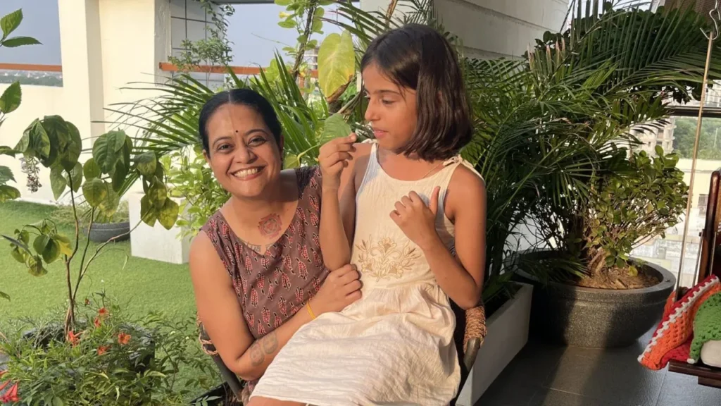 Rasesha with child enjoying and laughing 