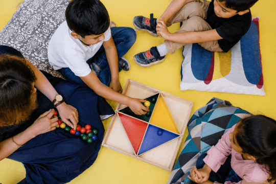 Children participating in a guided learning activity that teaches focus, attention, problem-solving, and emotional self-regulation skills.