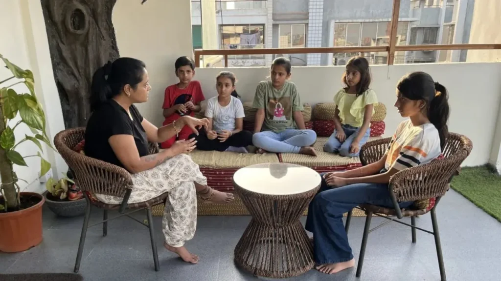 RasEsha Rabari guiding children during an Inner Literacy Education session in Ahmedabad, helping them develop emotional awareness, self-regulation, and confidence.